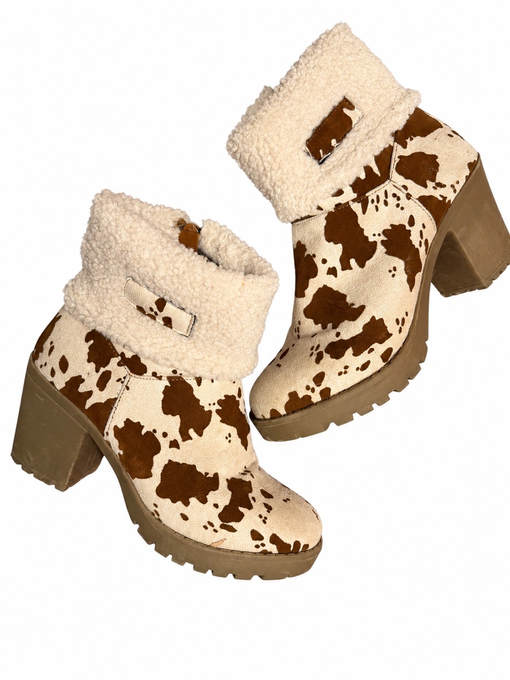 Pierre Dumas brown & cream cow print ankle boots with faux fur lining.